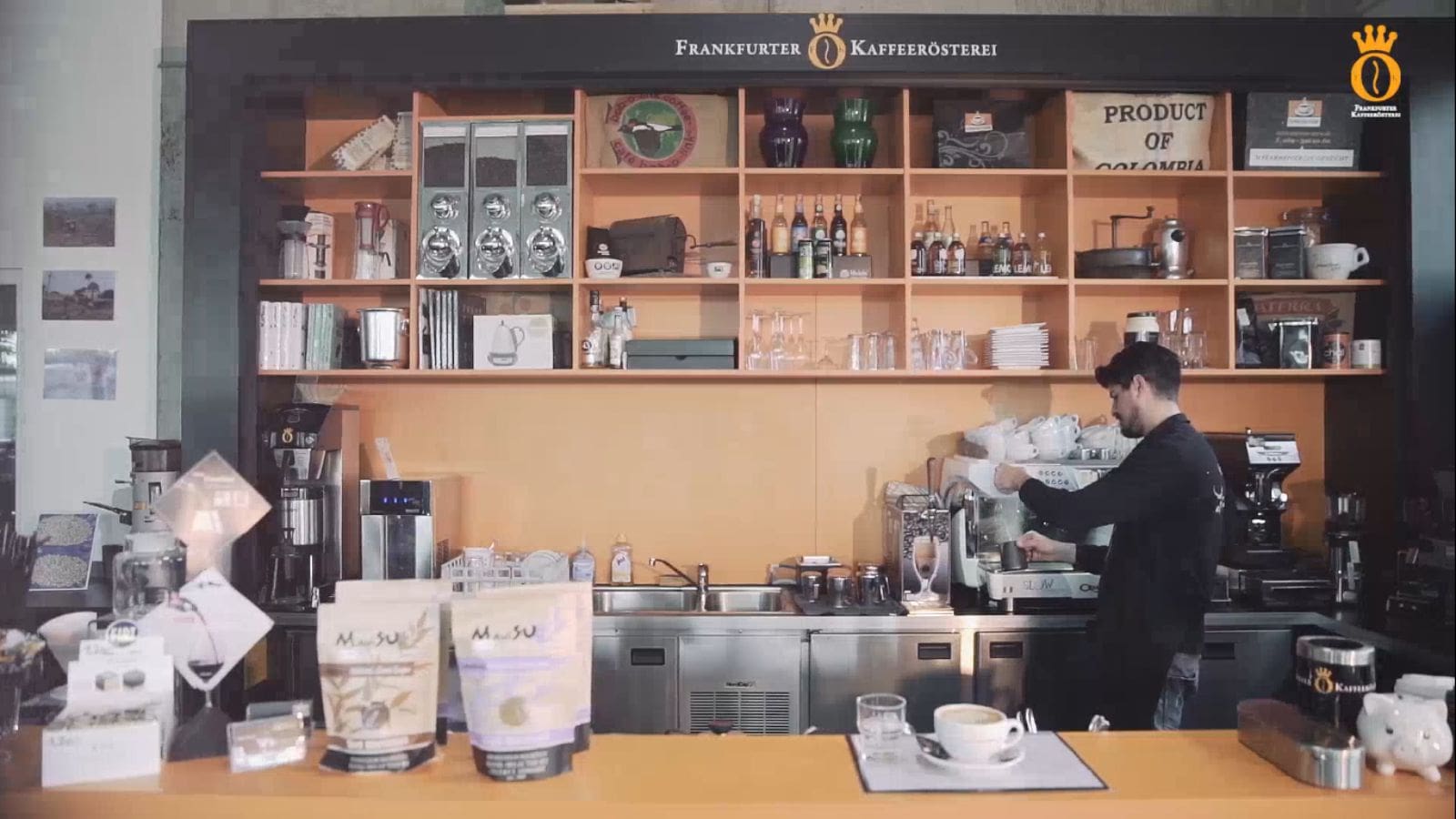 Barista at the Frankfurter Kaffeerösterei coffee bar, whose WooCommerce store GoDesign redesigned